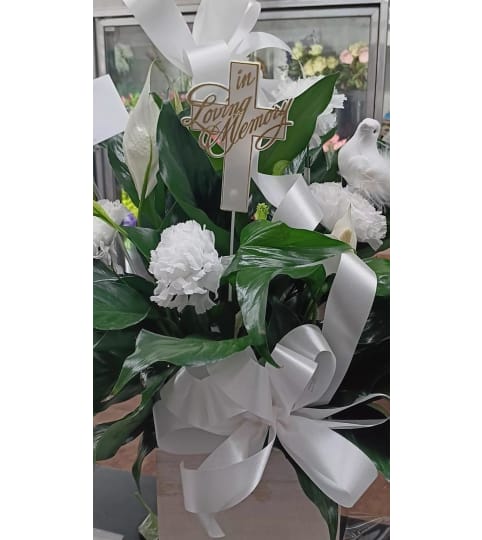 PEACE and SYMPATHY. An arrangement by Howard Beach Florist.