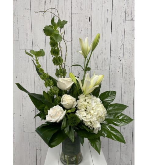 Botanical Beauty Bouquet with White Roses. An arrangement by Red Rose Incredible Florist.