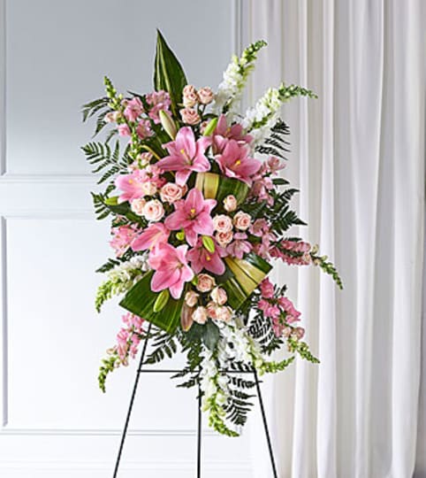 Elegant Embrace Easel Spray. An arrangement by North Liberty Flower Shop.