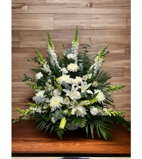 In The Clouds Tribute. An arrangement by DMP Flowers and Gifts.