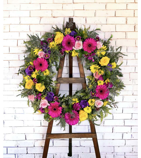 Garden of Solace Wreath. An arrangement by DMP Flowers and Gifts.