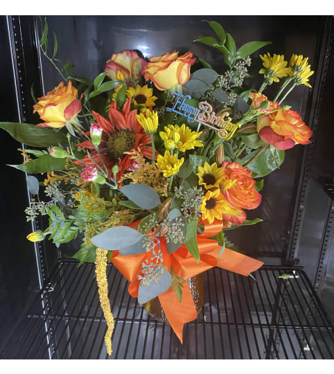 Hot Citrus. An arrangement by The Flower Box Florist.