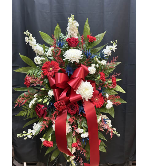 Patriotic Grace Tribute. An arrangement by Flowers by Neil.