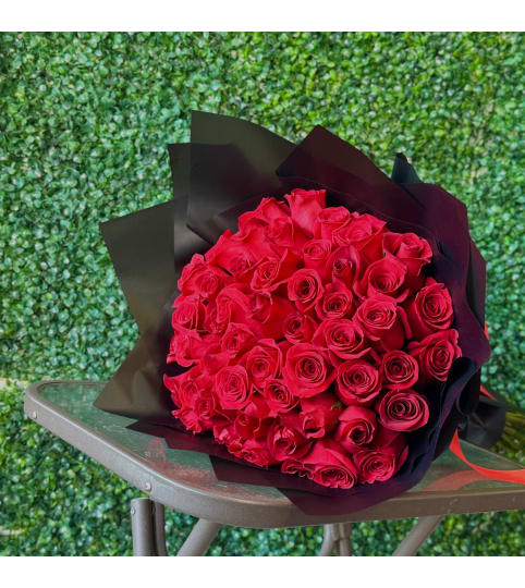 50 Red Rose Bouquet. An arrangement by Flower World and Gifts.