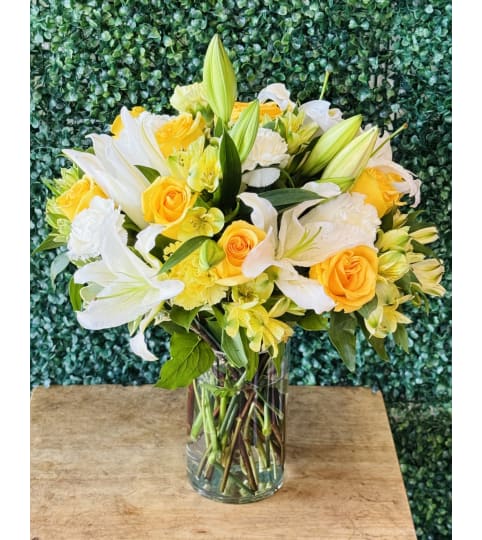 Sunny Floral Blooms. An arrangement by Flower World and Gifts.