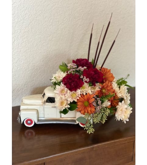Rustic Ride. An arrangement by Loyalist Flowers.