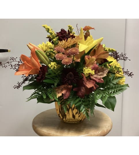 Glass Fall Arrangement. An arrangement by Roma Flowers and Gifts.