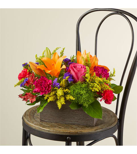 Backyard Party Bouquet by FTD. An arrangement by Country Cousins Flower Shop.
