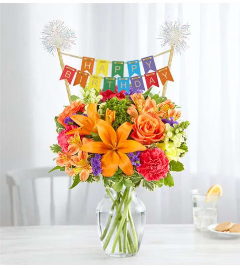 Vibrant Floral Medley™ with Happy Birthday Banner. An arrangement by Susana's Flowers.