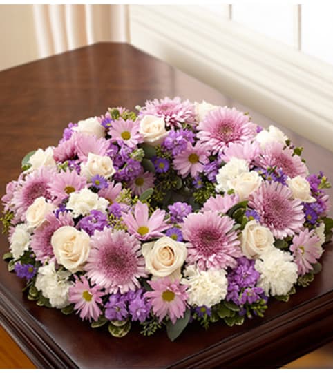 Cremation Wreath - Lavender and White. An arrangement by Graceland Florist.