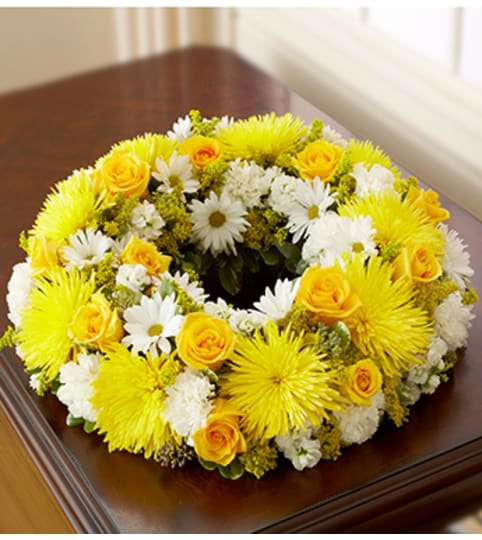 Cremation Wreath - Yellow and White. An arrangement by Graceland Florist.
