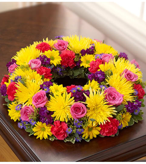 Cremation Wreath - Multicolor Bright. An arrangement by Graceland Florist.