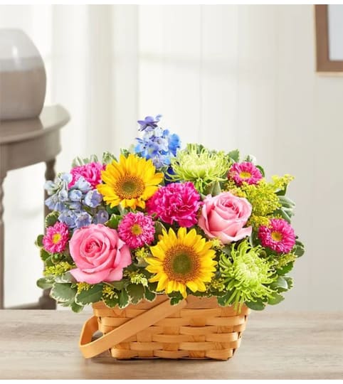 Sunny Garden Basket™. An arrangement by Susana's Flowers.