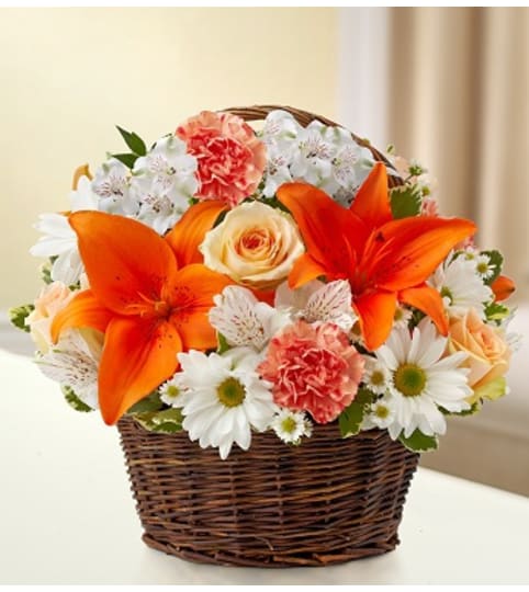 Peace, Prayers and Blessings - Peach, Orange and. An arrangement by Graceland Florist.