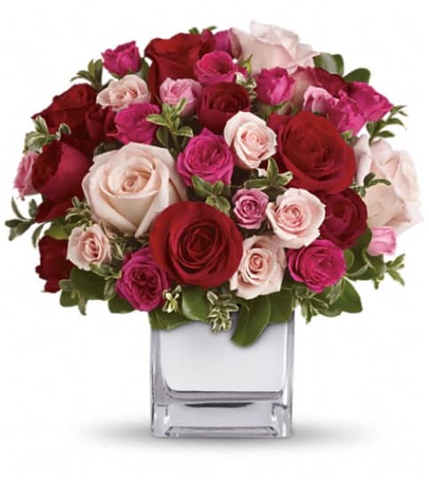 Teleflora's Love Medley Bouquet with Red Roses. An arrangement by Flowers and Pine World.