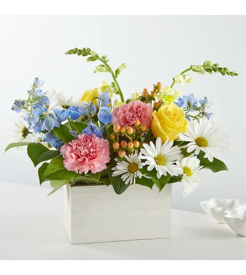 The Sun Salutation Box Bouquet. An arrangement by Country Cousins Flower Shop.