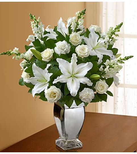All White Arrangement in Silver Vase. An arrangement by Blessing and Blooms Florist.