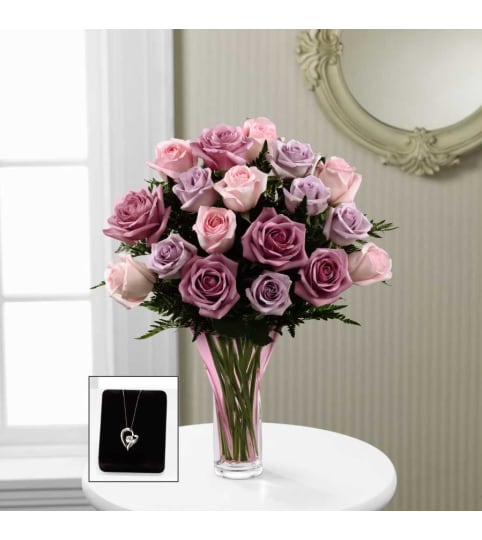 The FTD® Mixed Rose Bouquet with Pendant. An arrangement by Sandy's Florist.