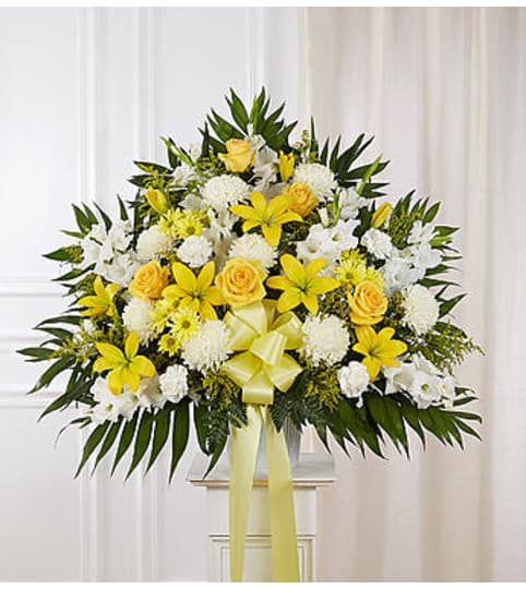 Heartfelt Sympathies™ Yellow Standing Basket. An arrangement by Graceland Florist.