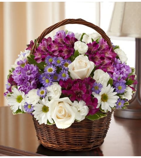 Peace, Prayers and Blessings - Lavender and Whi. An arrangement by Graceland Florist.