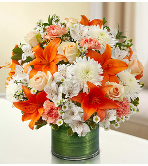 Cherished Memories - Peach, Orange and White. An arrangement by Graceland Florist.