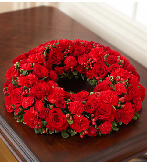 Cremation Wreath - All Red. An arrangement by Graceland Florist.