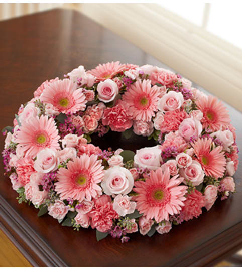 Cremation Wreath - All Pink. An arrangement by Graceland Florist.