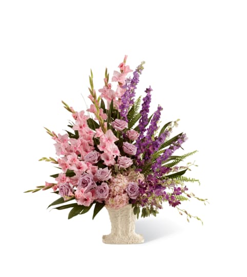 The FTD® Flowing Garden™ Arrangement. An arrangement by Country Cousins Flower Shop.