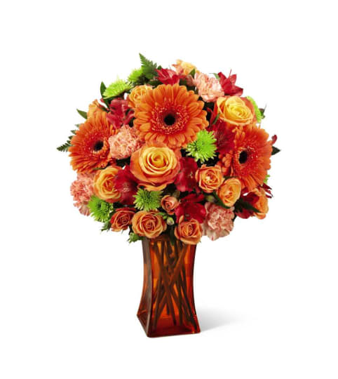 The FTD® Orange Escape Bouquet. An arrangement by Country Cousins Flower Shop.
