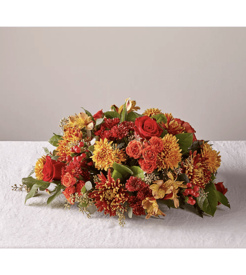 Bountiful Centerpiece. An arrangement by Country Cousins Flower Shop.