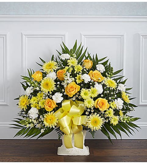 Heartfelt Tribute Yellow Floor Basket. An arrangement by Graceland Florist.