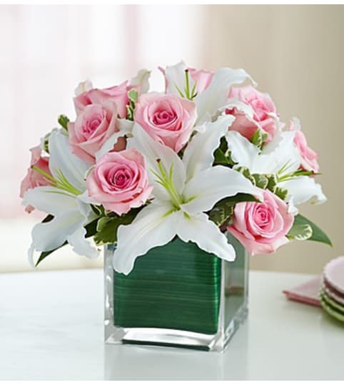 Modern Embrace Pink Rose and Lily Cube. An arrangement by Graceland Florist.