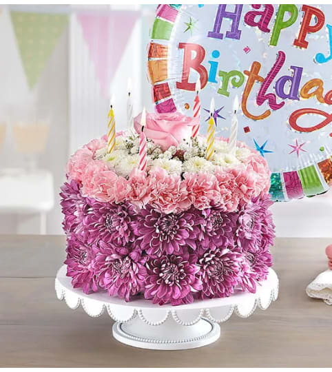 Happy Birthday Wishes Flower Cake™ Pastel. An arrangement by Susana's Flowers.