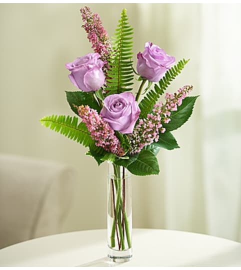 Love's Embrace™ Roses – Purple. An arrangement by Blessing and Blooms Florist.