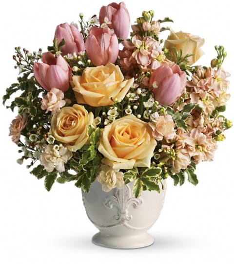 Teleflora's Peaches and Dreams. An arrangement by The Village Green Florist.