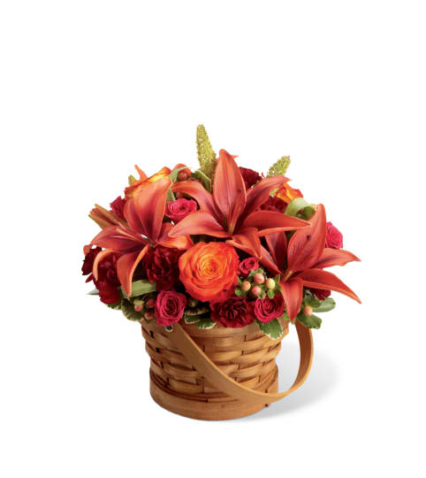 The FTD® Abundant Harvest™ Basket with Lilies. An arrangement by Country Cousins Flower Shop.