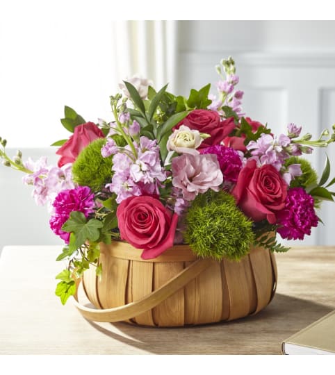 Radiance in Bloom Basket. An arrangement by Country Cousins Flower Shop.