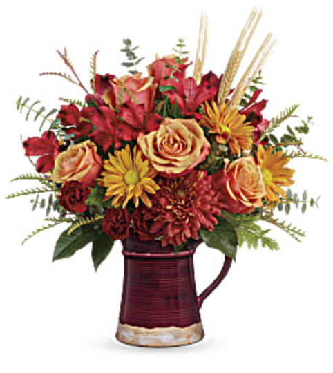 Teleflora's Fields Of Fall Bouquet. An arrangement by White's Flowers.