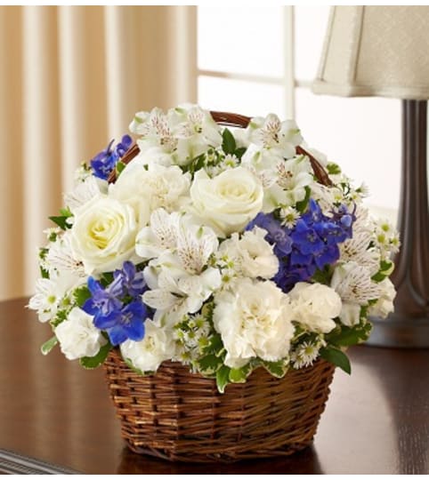 Peace, Prayers and Blessings - Blue and White. An arrangement by Graceland Florist.