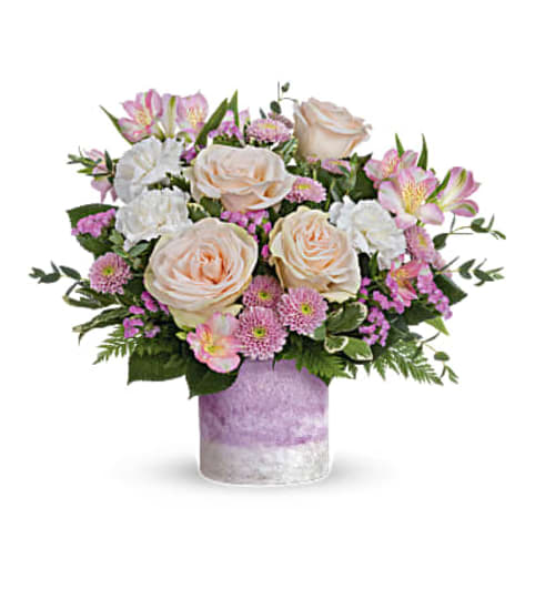 The Teleflora's In A Blush Bouquet. An arrangement by Marivel's Florist and Gifts.