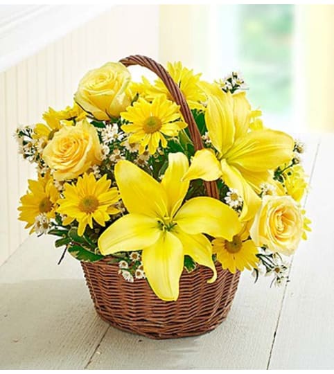 Basket of Sunshine™ with Roses. An arrangement by Susana's Flowers.