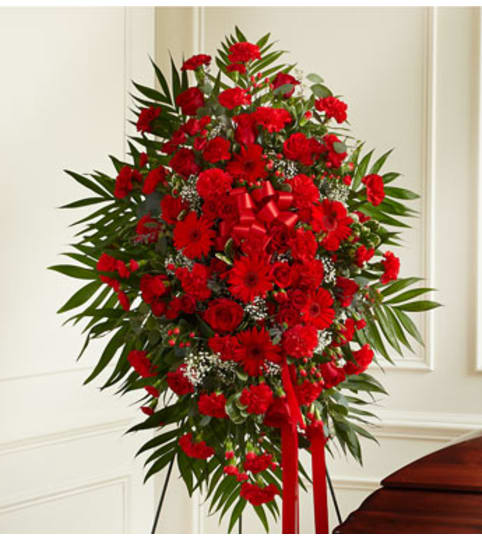 Red Mixed Sympathy Standing Spray. An arrangement by Graceland Florist.