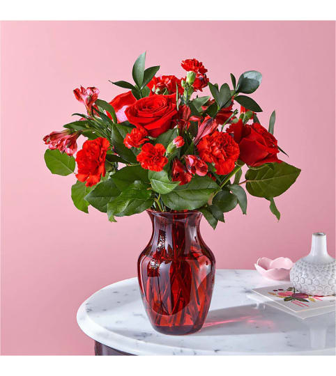 The Heartstrings Bouquet by FTD. An arrangement by Country Cousins Flower Shop.