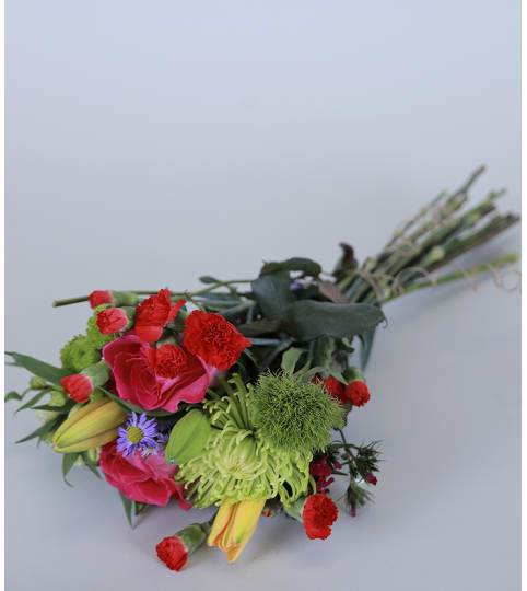 Seasonal Wraps. An arrangement by Lee's Corner Floral Shop.