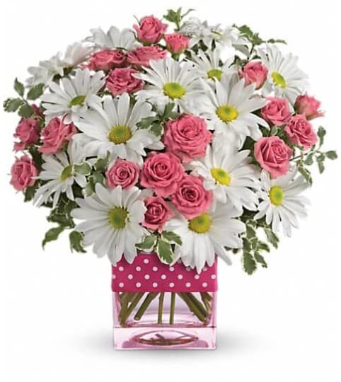 Teleflora's Polka Dots and Posies. An arrangement by Burlington Florist.
