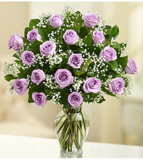 Rose Elegance™ Premium Purple Roses. An arrangement by Susana's Flowers.