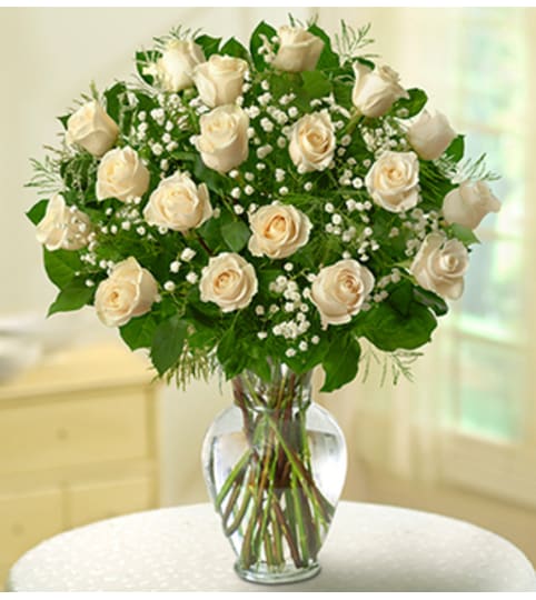 Rose Elegance™ Premium White Roses. An arrangement by Susana's Flowers.