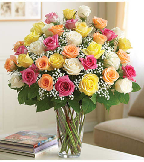 Ultimate Elegance™ Long Stem Assorted Roses. An arrangement by Susana's Flowers.
