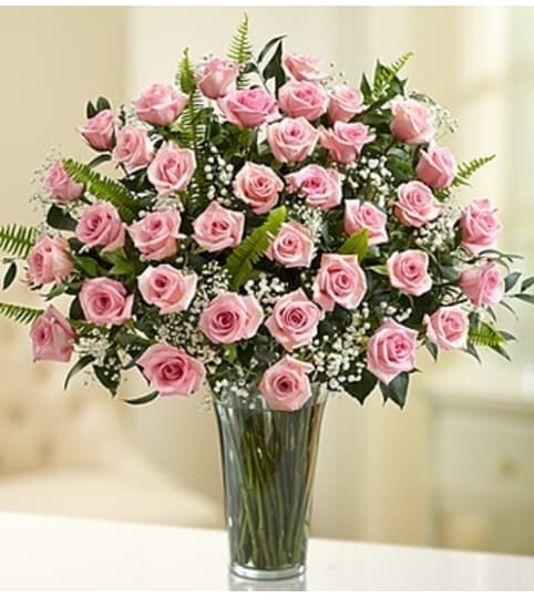 Ultimate Elegance™ Long Stem Pink Roses. An arrangement by Susana's Flowers.
