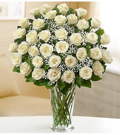 Ultimate Elegance™ Long Stem White Roses. An arrangement by Susana's Flowers.